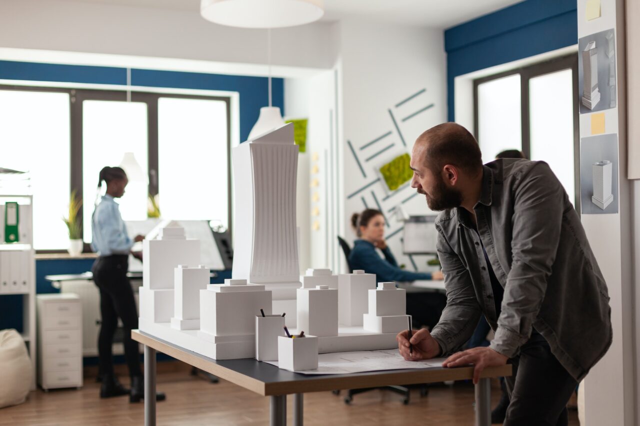 Man working on architectural design at office