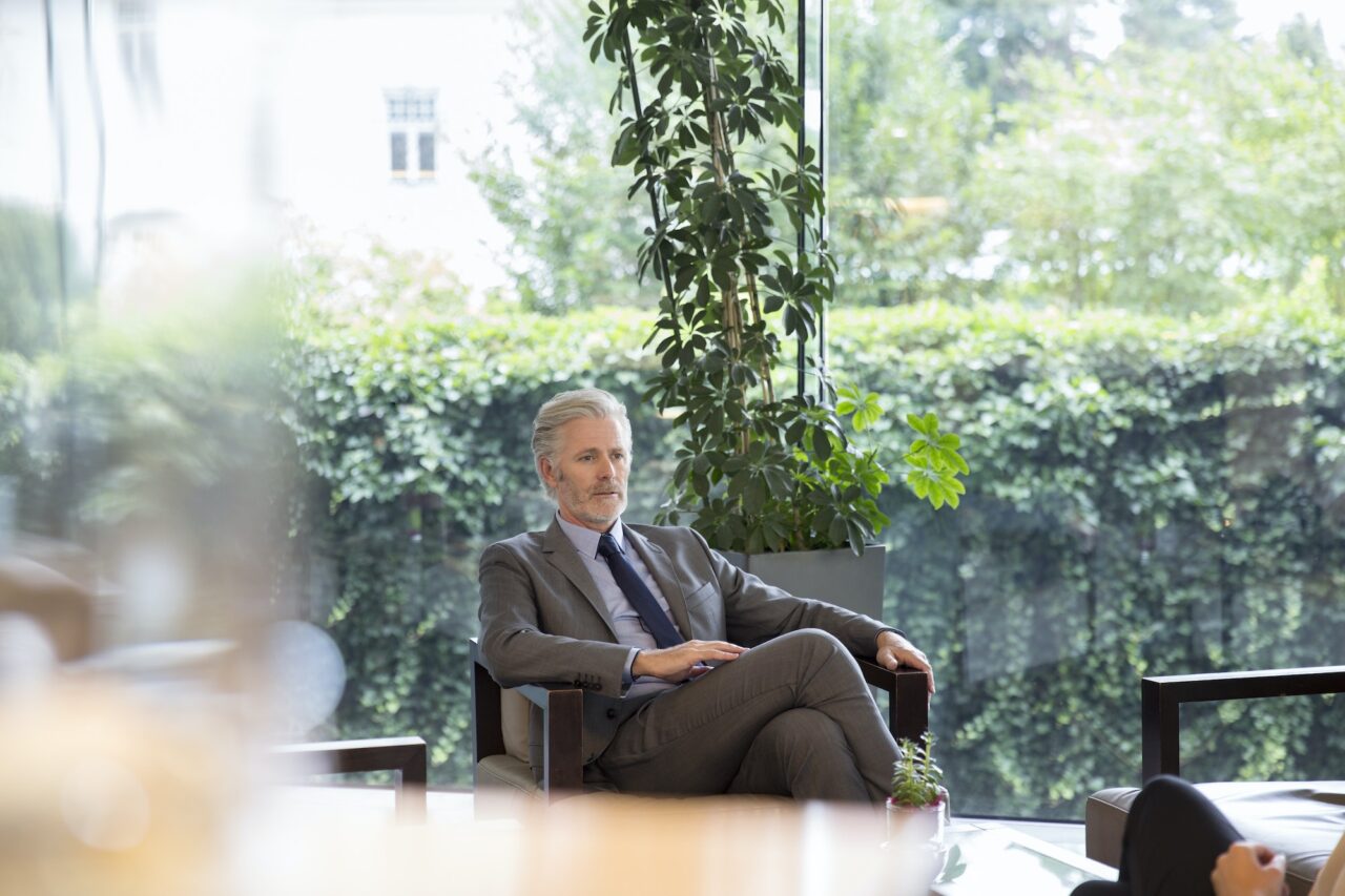 Businessman sitting in hotel lobby